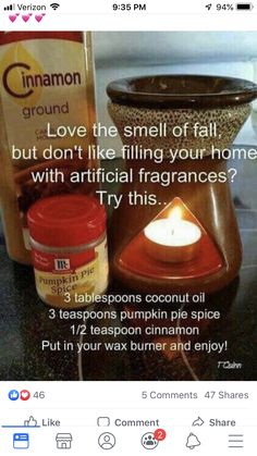 a candle and some jars on a table with information about cinnamon spice in front of it