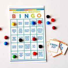 a game board with pins and numbers on it next to some magnets that read,'doctrinal master bingo '