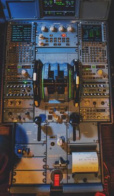 the control panel of an airplane with multiple controls on it's sides and buttons