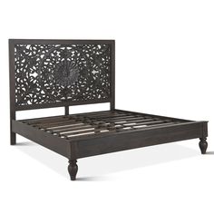 the bed frame has an intricate design on it