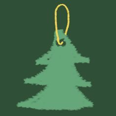 a green christmas tree ornament hanging from a yellow string on a black background