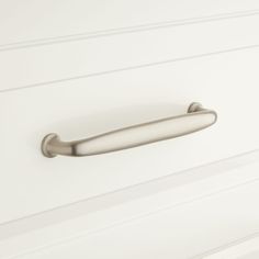 a white cabinet door with a handle on it