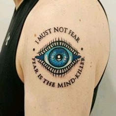 a man with a tattoo on his shoulder that says i must not fear fear is the mind killer