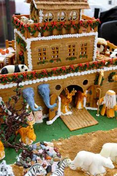 an elaborate gingerbread house with animals and decorations