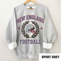 Perfect sweatshirt for New England football fans this season! Ideal for any situation, a unisex heavy blend crewneck sweatshirt is pure comfort. These garments are made from polyester and cotton. This combination helps designs come out looking fresh and beautiful. The collar is ribbed knit, so it retains its shape even after washing. There are no itchy side seams on these sweaters.  .: 50% cotton, 50% polyester .: Medium-heavy fabric (8.0 oz/yd² (271.25 g/m .: Loose fit .: Sewn-in label .: Runs Patriot Football, England Football Shirt, Heat Press Printing, Patriots Football, Football Gift, Football Sweatshirt, England Football, Sweatshirt Vintage, Football Gifts