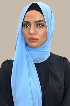 Our Luxury Chiffon hijab-Arctic Blue is perfect for every occasion. With the softest chiffon fabric we could find, our Luxury Chiffon will become your go to hijab whether you're going out to a fancy party or keeping it casual, looking beautiful is effortless! Fabric: Polyester Chiffon Dimension: 70" x 27" Contour: Long Rectangle Thickness: Light Texture: Smooth Care: Machine or hand wash in warm water, tumble dry or air dry, iron if needed. Elegant Blue Hijab For Eid, Hijab Fabric, Chiffon Hijab, Arctic Blue, Fancy Party, Light Texture, Chiffon Fabric, Air Dry, Warm Water