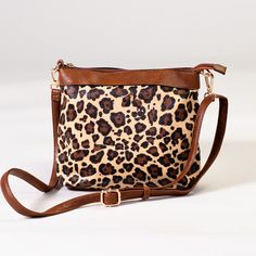 Just the right size for the few things you need when you're making a quick trip or having a fun night out. This adjustable cross body sling has an interior zipper pocket and a zipper closure and comes in those colors you can match with anything in your wardrobe! 9"h x 10.5"w Wildest Dreams, Black And Tan, Tan Brown, Cross Body, Zipper Pocket, Night Out, Animal Print, Crossbody Bag, Zipper