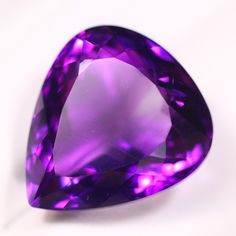 an amethyst purple diamond on a white background