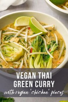 a white bowl filled with green curry and vegetables