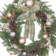 a christmas wreath with pine cones and ornaments