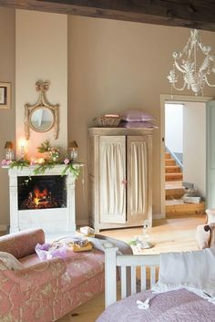 a living room filled with furniture and a fire place