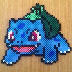 a close up of a piece of art made out of perler beads