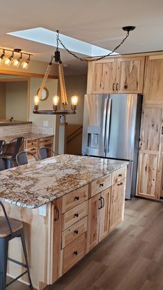 rustic kitchen Hickory Island Kitchen, Bars Made From Kitchen Cabinets, Clear Hickory Cabinets, Kitchen Remodel Hickory Cabinets, Modern Hickory Kitchen, Single Wide Kitchen Ideas Small Spaces, Hickory Kitchen Cabinets White Counter, Kitchen Remodel Lighting, Flooring For Hickory Cabinets