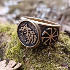 Be brave as wolf with this bronze ring Introducing our unique Slavic wolf ring - a perfect addition to any pagan or Viking jewelry collection. This wolf ring is handcrafted with intricate attention to detail and features a Slavic Kolovrat sun wheel, a symbol of the sun and life force, and a fierce wolf head, a symbol of strength and protection.This pagan ring is made from high-quality bronze or silver solid and is adorned with pagan and Viking symbols that represent the strength and power of the Pagan Ring, Sun Wheel, Wolf Ring, Viking Culture, Viking Symbols, Pagan Jewelry, Symbols Of Strength, Bronze Ring, Symbol Of Strength