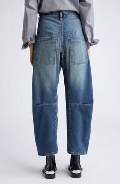 Made from faded denim with a hint of stretch, these jeans have relaxed barrel legs, seamed knees and utility pockets for a contemporary silhouette. 26" inseam, 17" leg opening; 11 3/4" front rise; 16" back rise (size 29) Zip fly with button closure Front patch pockets; back patch pockets 98% cotton, 2% polyurethane Hand wash, line dry Made in the USA