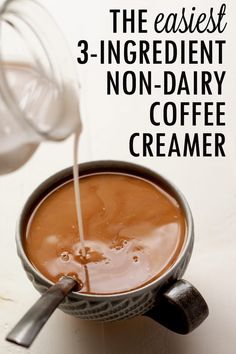 a cup of coffee being poured into it with the words, the easy 3 ingredient non dairy coffee creamer