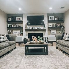 a living room filled with furniture and a flat screen tv mounted on the wall above a fire place