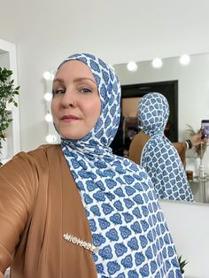 Gorgeous blue medallion hijab reminds you of the Blue Mosque and so many beautiful places in Turkey and Morocco. This is a must-have hijab for year round! Premium jersey hijab made in limited edition prints. Available in two hijab styles! Select your style from the drop down menu. Measurements: approx. 28" x 70”. (standard length) Color: Off-white with turquoise and blue pattern. Pattern placement varies. NYC designer overstock fabric. Feel: Lightweight and soft feeling. Similar feel to some of Traditional Blue Hijab For Eid, Hijab Turkish, Printed Hijab Scarfs, Jersey Hijab, Turkish Tea, Blue Mosque, Nyc Design, Blue Pattern, Limited Edition Prints