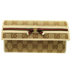 Gucci Sherry Line 256998 GG Canvas Leather Beige Bifold Long Wallet 5H0074GUCCIBrand: GucciGender: WomenModel: 256998Country of Origin: ItalyColor: BeigeMaterial: GG canvasSize (HxWxD): 10.5cm x 19cm x 1.5cm / 4.13'' x 7.48'' x 0.59'' Italy Design, Gucci Models, Vuitton Bag, Luxe Fashion, Bags Designer Fashion, Exclusive Bag, Canvas Leather, Long Wallet, Prada Bag