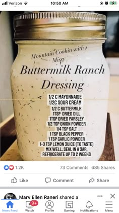 a jar of buttermilk ranch dressing sitting on a wooden table with instructions to make it