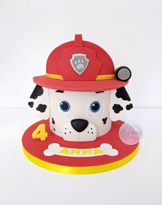 a cake shaped like a fireman's dog