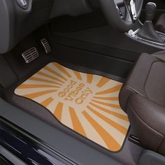 the interior of a car with an orange and white floor mat that says, get 50 % off