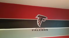 the atlanta football team is painted on the wall in this room with red, white and black stripes