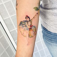 a woman with a flower tattoo on her arm