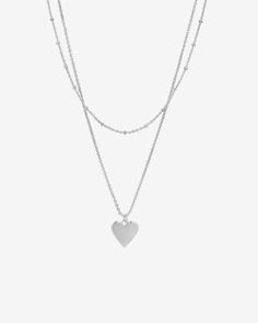 This layered necklace features a dainty shorty chain with a longer chain that has Heart Pendant. Materials: 14K yellow, rose or white gold plated Minimalist Heart Pendant Chain Necklace, Minimalist Delicate Chain Necklace With Heart Pendant, Minimalist Heart Shaped Chain Necklace, Dainty Double Chain Sterling Silver Necklace, Trendy Heart-shaped Double Chain Necklace, Minimalist Heart-shaped Delicate Chain Necklace, Minimalist Heart-shaped Chain Necklace, Trendy Double Chain Heart Necklace, Valentine's Day Heart Pendant Layered Necklace