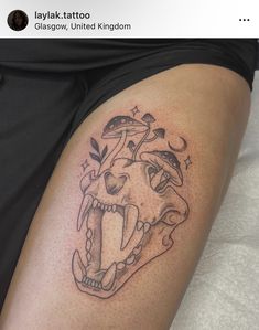 a person with a tattoo on their thigh