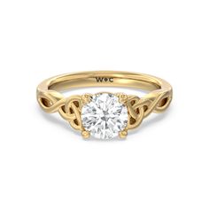 a rose gold engagement ring with an oval cut diamond in the center and two intertwined sides