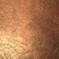 a close up view of the surface of a metal plate with some rust on it