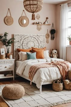 a bedroom with pink walls, white bedding and wicker baskets on the wall