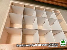 an open drawer is shown with the lid opened to show drawers for items in it