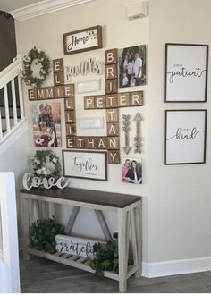 the wall is decorated with family pictures and other things to put on it's walls