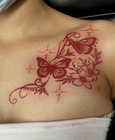 a woman with a butterfly tattoo on her chest