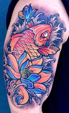 a colorful tattoo with a fish on it's arm