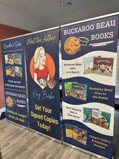 two signs advertising books in an office lobby