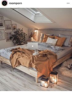 a bed room with a laptop on top of it