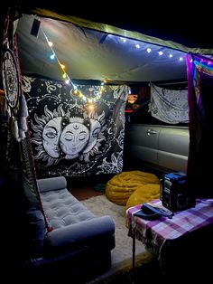 the inside of a tent is lit up with lights