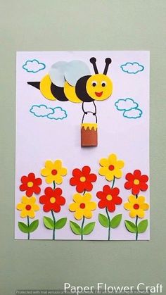 a paper flower card with a bee on it