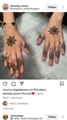 two hands with henna tattoos on them