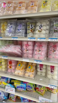 shelves in a grocery store filled with lots of different types of eggs and other foods