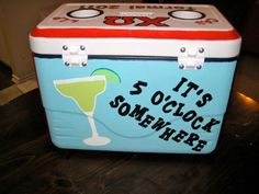 an ice chest with a drink in it that says it's oclock somewhere