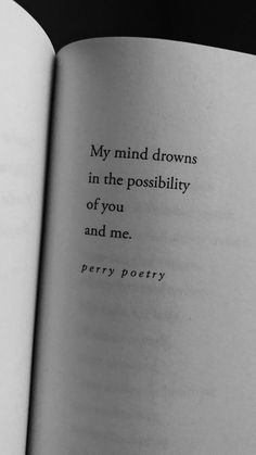 an open book with a poem written in black and white on the page, which reads my mind drowns in the poissibity of you and me