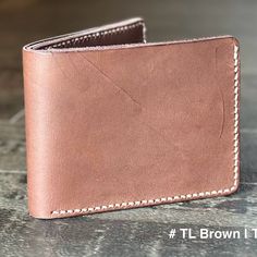 This Men's Wallet Is A Must-Have Accessory For Any Fashion-Conscious Man. Made From 100% Genuine Leather, This Wallet Is Both Stylish And Durable, Ensuring That It Will Stand The Test Of Time.With A Classic Bifold Design, This Wallet Features Several Credit Card Slots And A Folding Compartment For Bills. The Unique Brown Color And Hand-Stitched Accents Give This Wallet A Unique And Timeless Look. Perfect For Everyday Use Or Special Occasions, This Wallet Is A Great Addition To Any Man's Accessor Brown Leather Wallet With Leather Patch, Classic Bifold Wallet With Leather Patch, Tan Leather Wallet, Rectangular, Tan Leather Rectangular Wallet, Leather Wallet With Coin Pocket In Cognac, Cognac Leather Wallet With Coin Pocket, Cognac Leather Wallet With Smooth Grain, Brown Bifold Wallet With Leather Patch, Tan Leather Wallet With Interior Card Slots