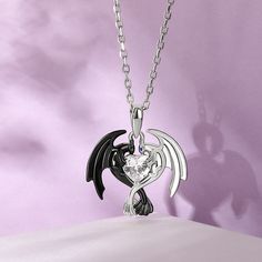 Can you believe it? This dragon couple's relationship is one of the strongest romance relationship in the fictional world. Crafted in sterling silver, this necklace in Hug Me® collection shows a loving dragon couple hugged a heart-cut stone together. As a great Valentine and Christmas gift, the meaningful necklace celebrates your everlasting love. You will find more adorable and creative designs in our Hug Me® collection.Carat Weight: 0.5 ctStone Size: 5*5 mmStone Type: Jeulia® StoneNumber of St Gothic Sterling Silver Heart Pendant Jewelry, Gothic Sterling Silver Necklace For Valentine's Day, Dragon Couple, Couple Heart, Meaningful Necklace, Princess Jewelry, Teen Outfits, Dragon Necklace, Couple Necklaces