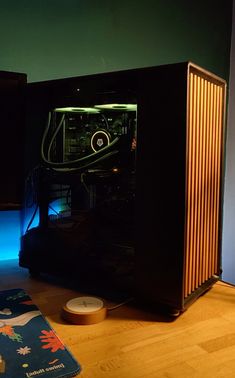 a computer case sitting on top of a wooden floor