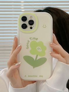 a woman is holding up her phone case with a flower on the front and side