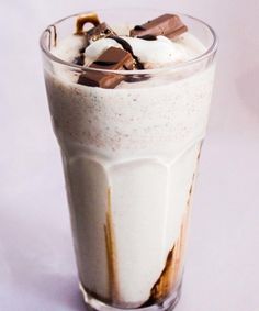 a tall glass filled with ice cream and chocolate